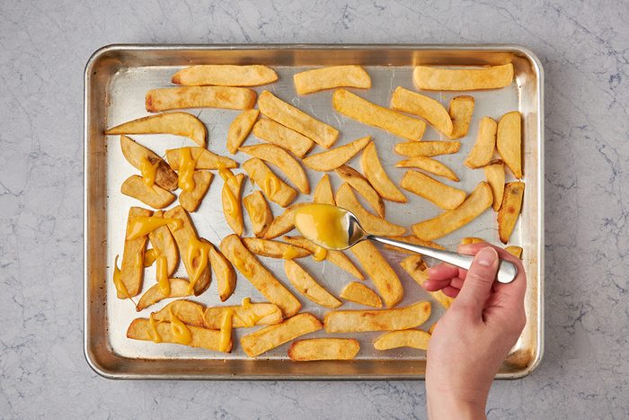 Assemble cheese fries