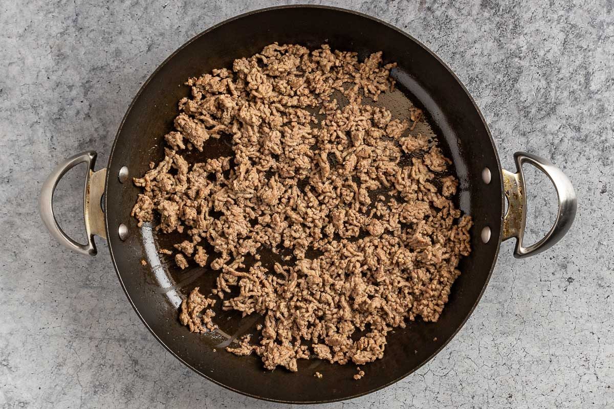 Taste of Home Cheeseburger Macaroni photo of the cooked ground beef in a skillet.