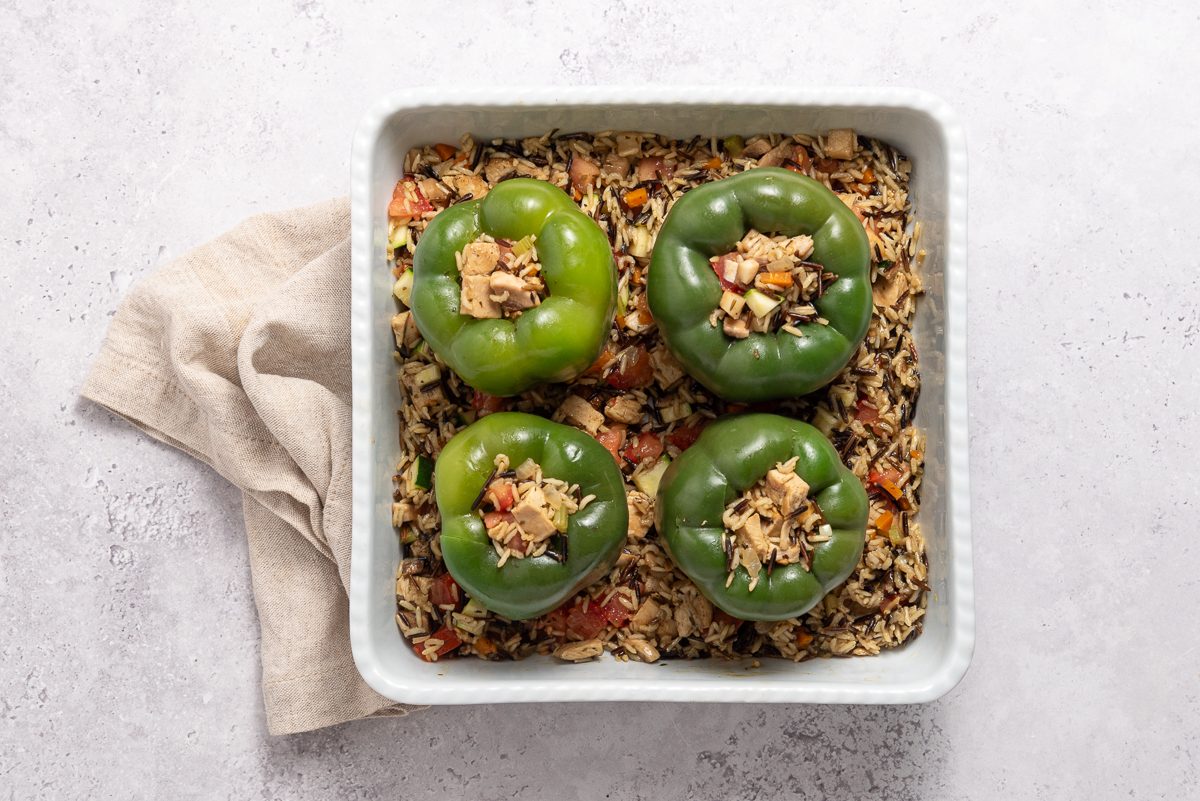 Green Pepper In Baking Dish Filled With Chicken Rice Filling