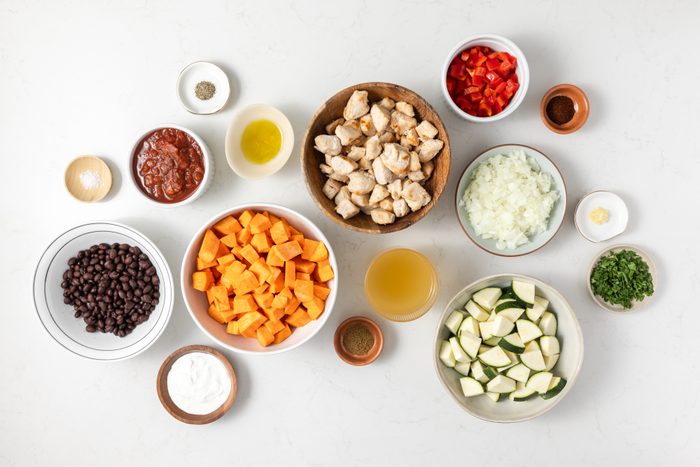 Ingredients for chicken sweet potato skillet on kitchen counter.