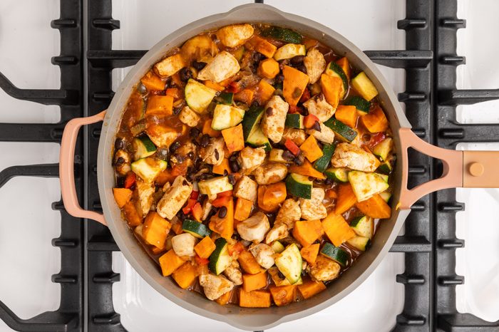 Chicken sweet potato skillet being finalized.