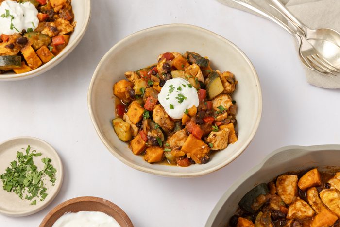 Chicken sweet potato skillet ready and served in bowls.