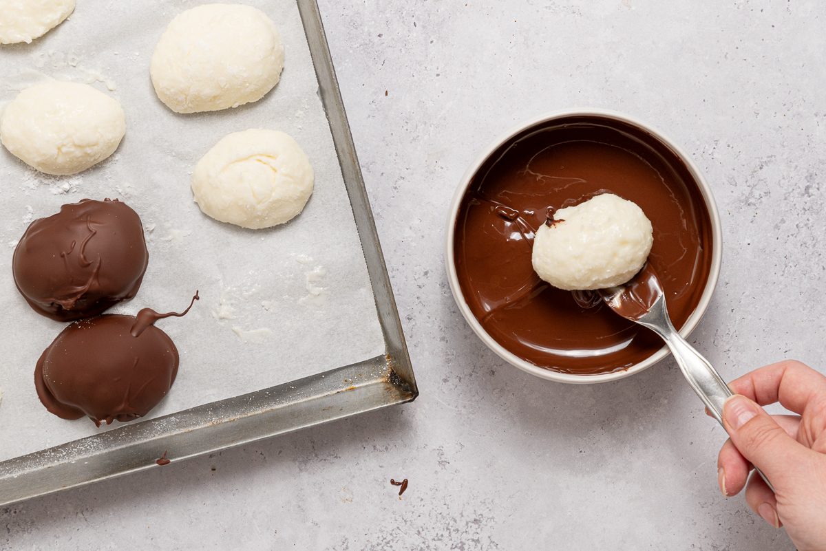 Frozen Cream Cheese Coconut Eggs Dipped In Melted Chocolate
