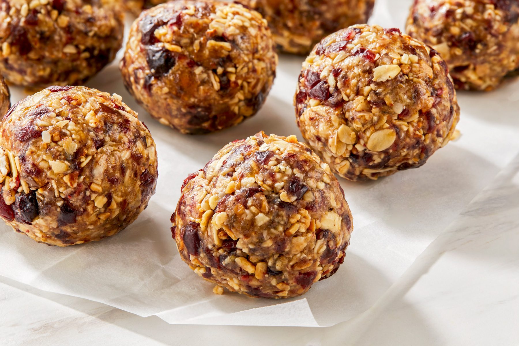 A close-up shot of cranberry almond energy balls, highlighting their texture.