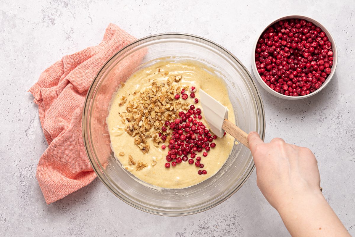 Spatula Mixing Into Cranberry Walnut Bread Batter