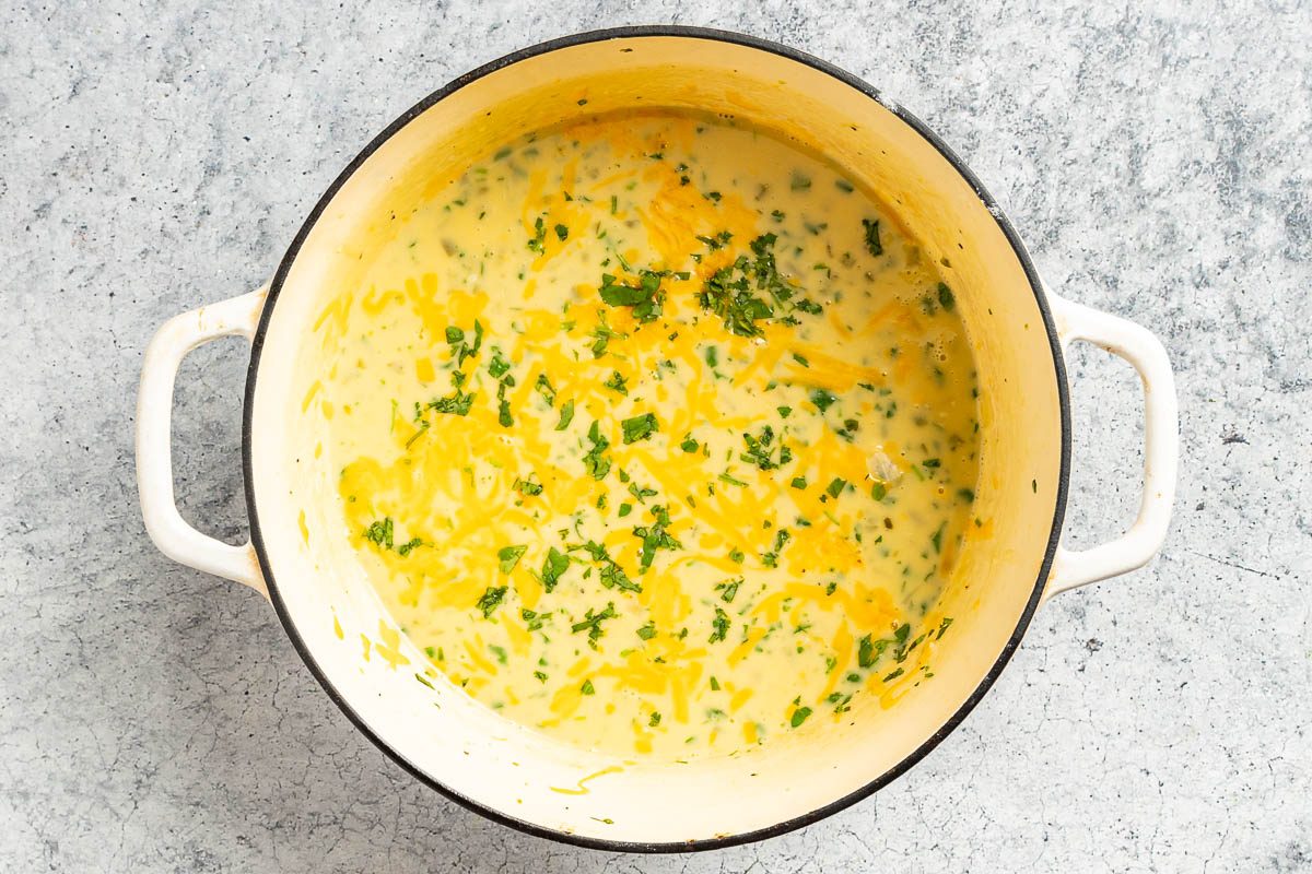 Taste of Home Cream of Jalapeno Soup photo of cooked soup topped with cheese and fresh cilantro.