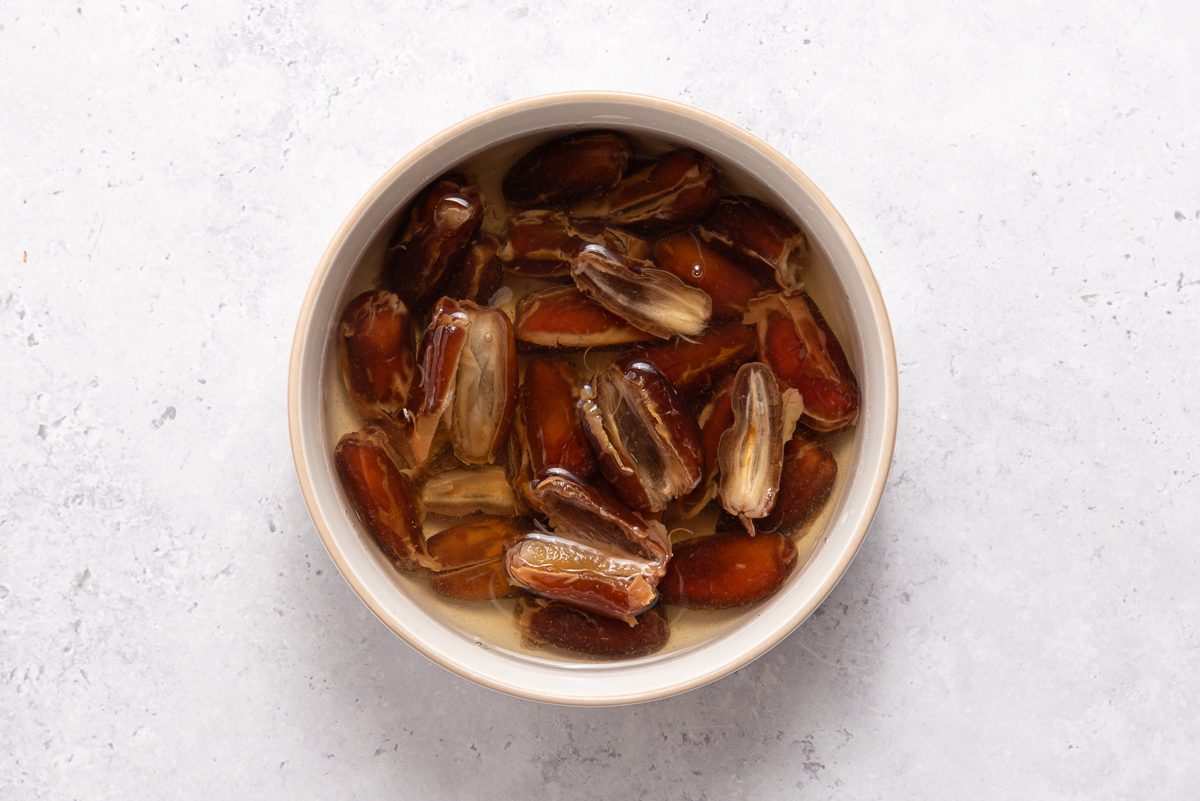 Pitted Dates Covered With Water Inside Bowl