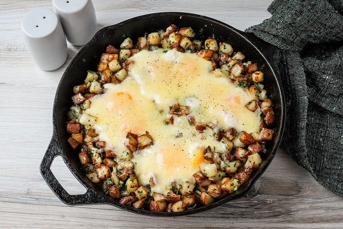Potatoes and eggs with a cheddar cheese topping, ready to enjoy.
