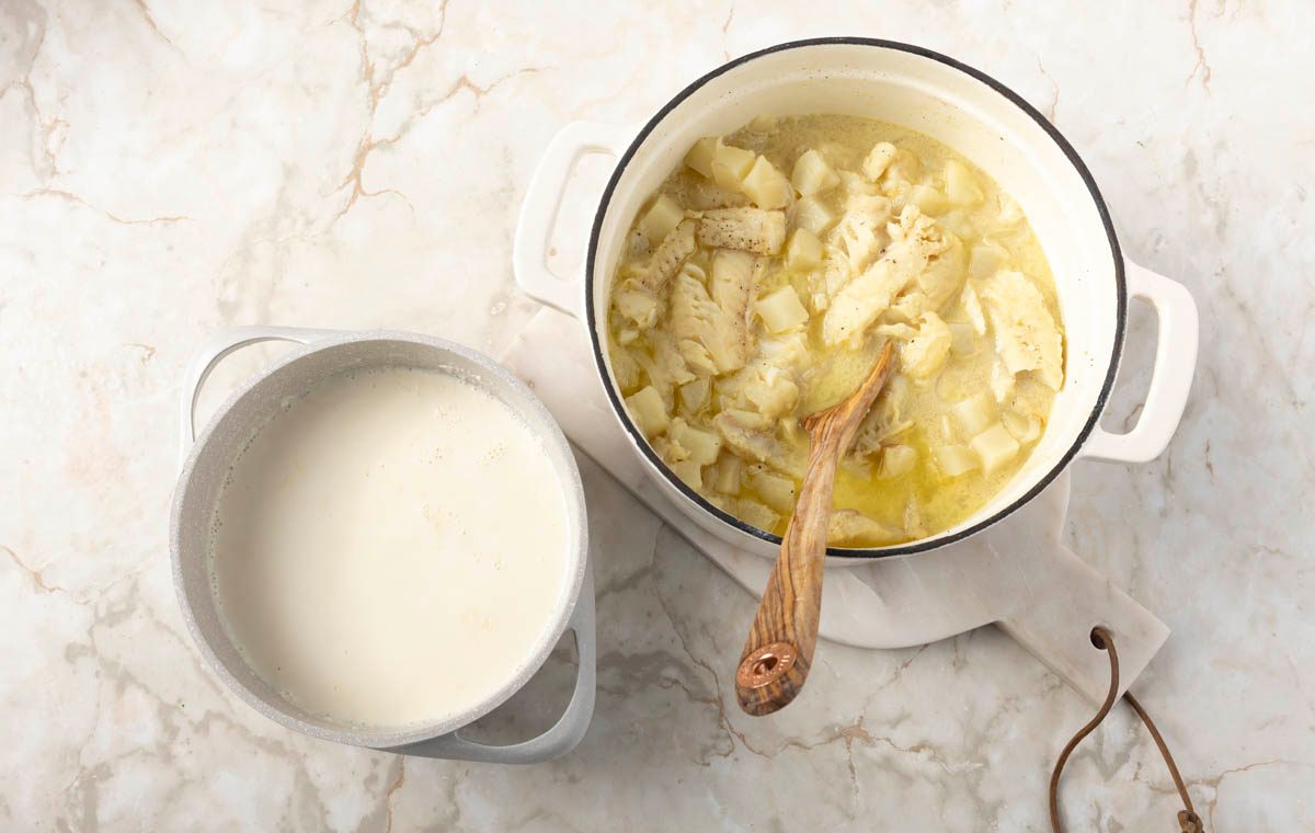 Combine the fish and potato base into the creamy broth for fish Chowder