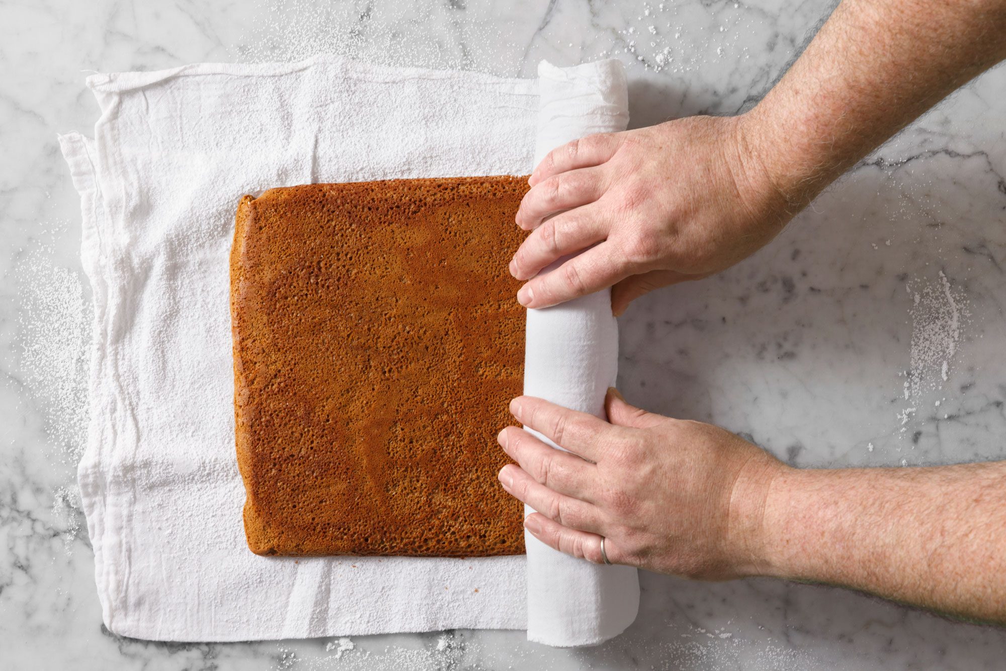 Roll up cake in the towel jelly-roll style, starting with a short side.