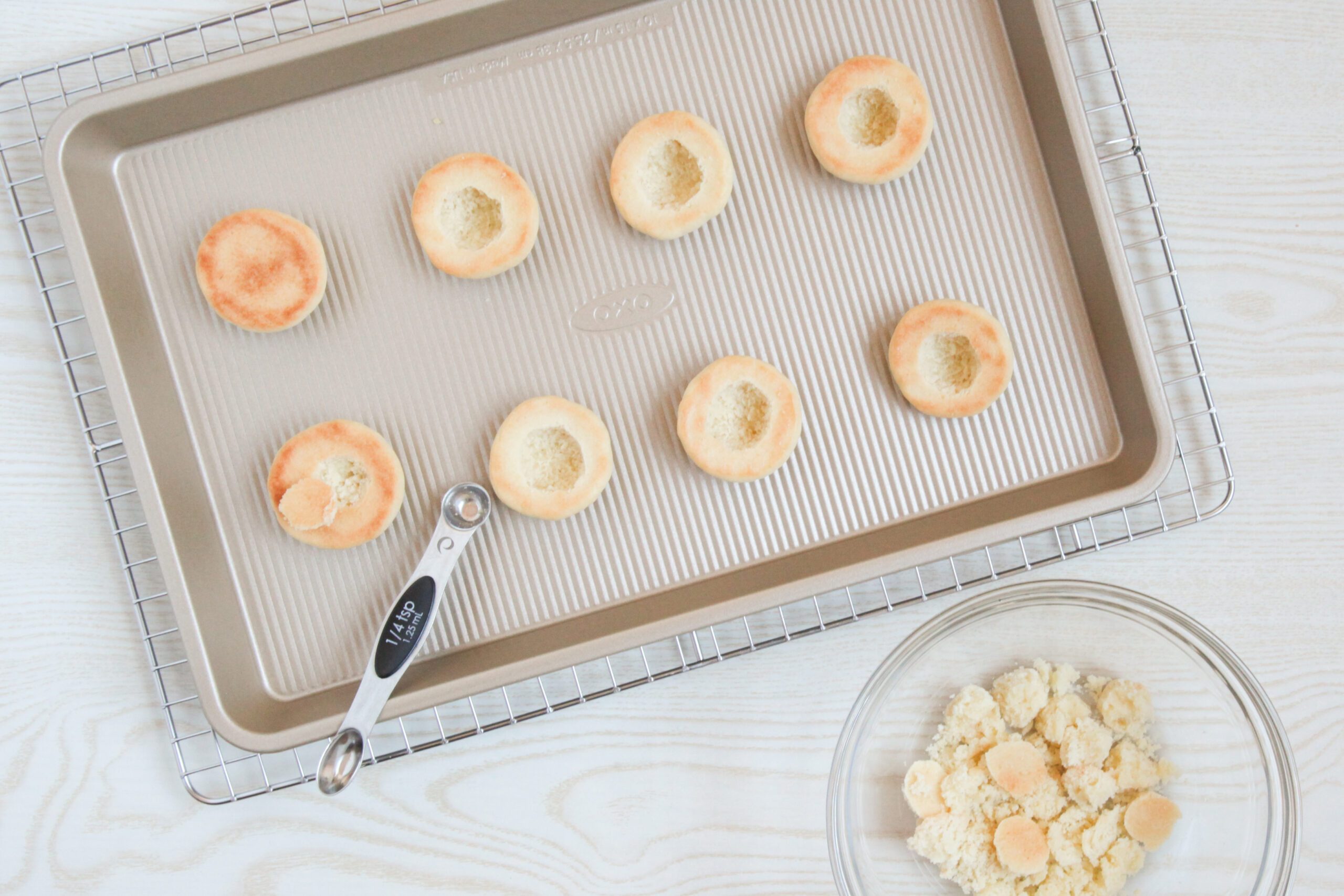 Hollowing out the centers of Italian Peach Cookies