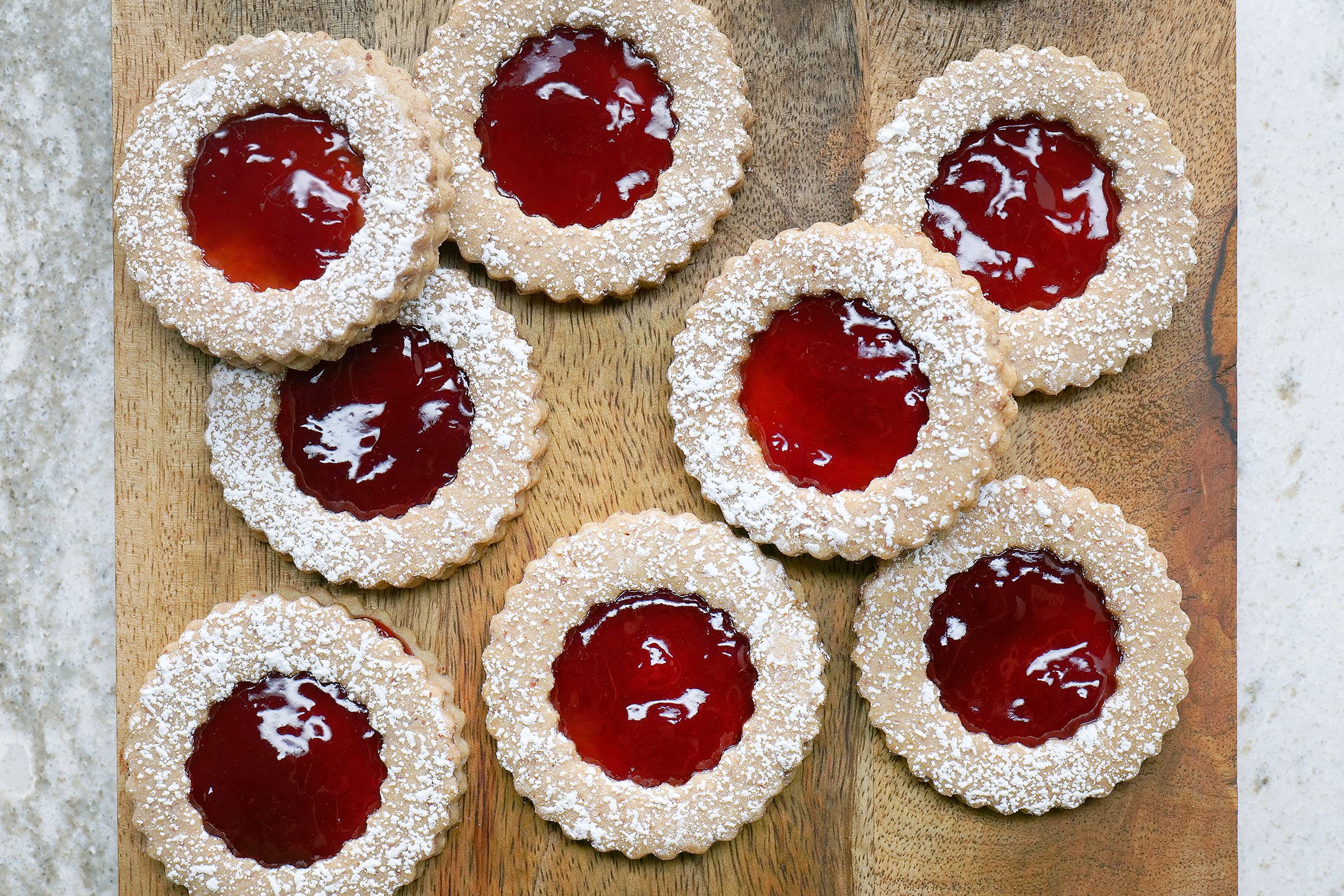 Linzer Cookies placed on a wooden tray