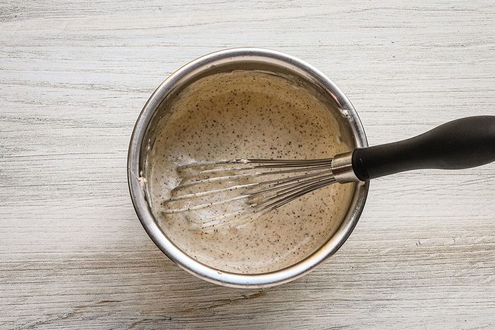 Whisking the dressing mixture for Mexican street corn pasta salad.