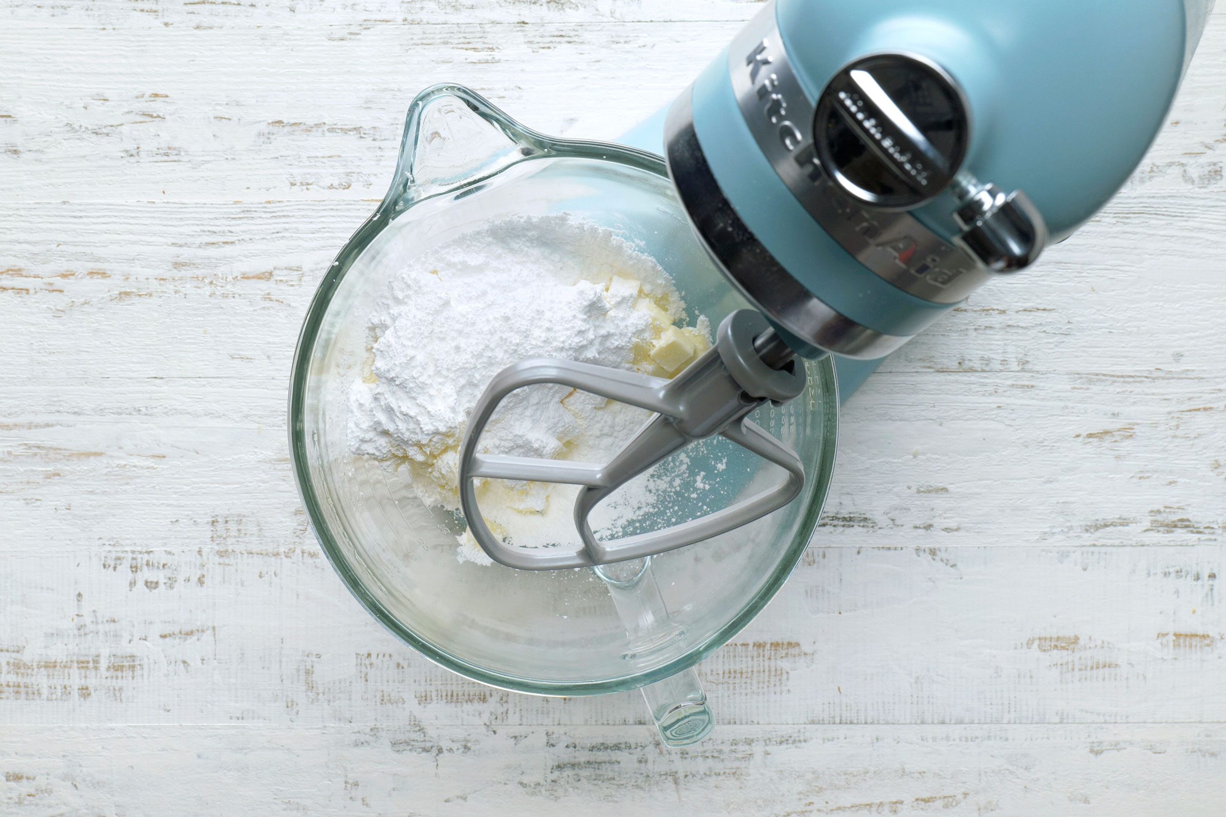 Mixing butter and sugar in a bowl