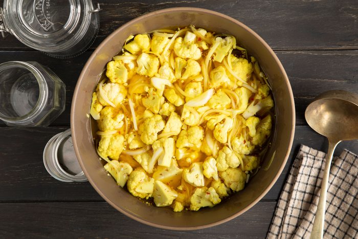 A bowl of pickled cauliflower on table top