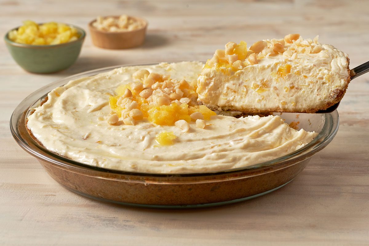 A close-up shot of the Pineapple Pie filling, highlighting the creamy texture and crushed pineapple on top.