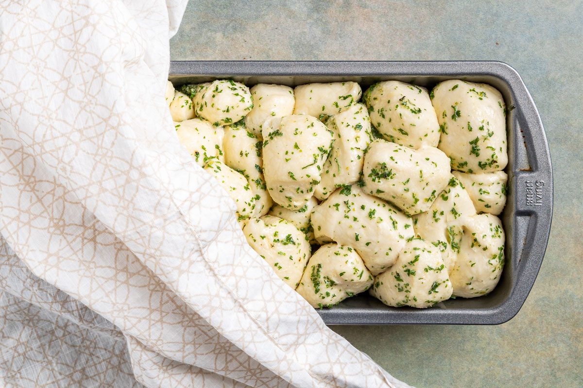 Taste of Home Pull Apart Garlic Bread photo of the risen dough in a loaf pan.