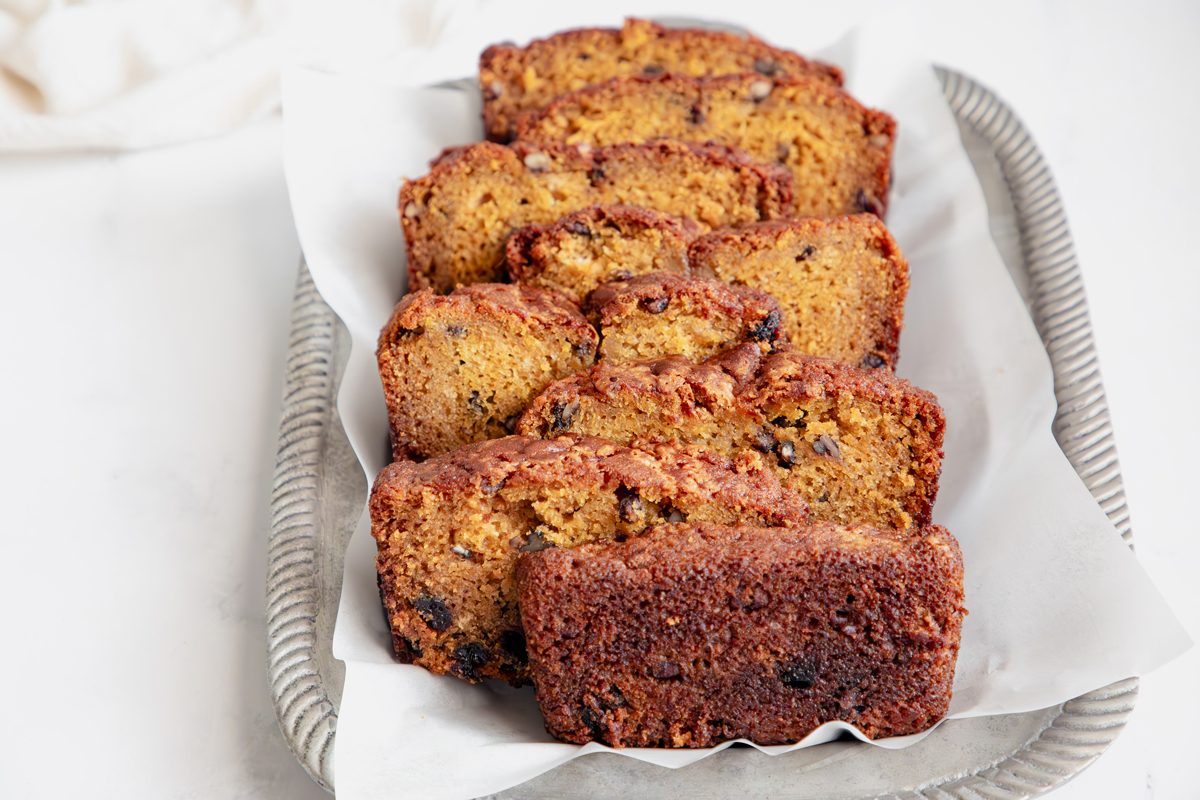 Overhead shot For Taste Of Home Pumpkin Raisin Bread On A Silver Platter.