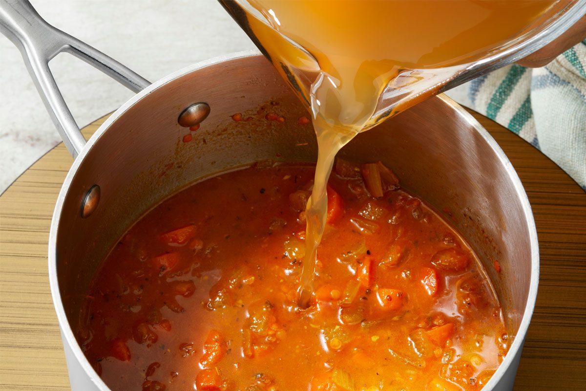 Gradually Adding Stock into the pot