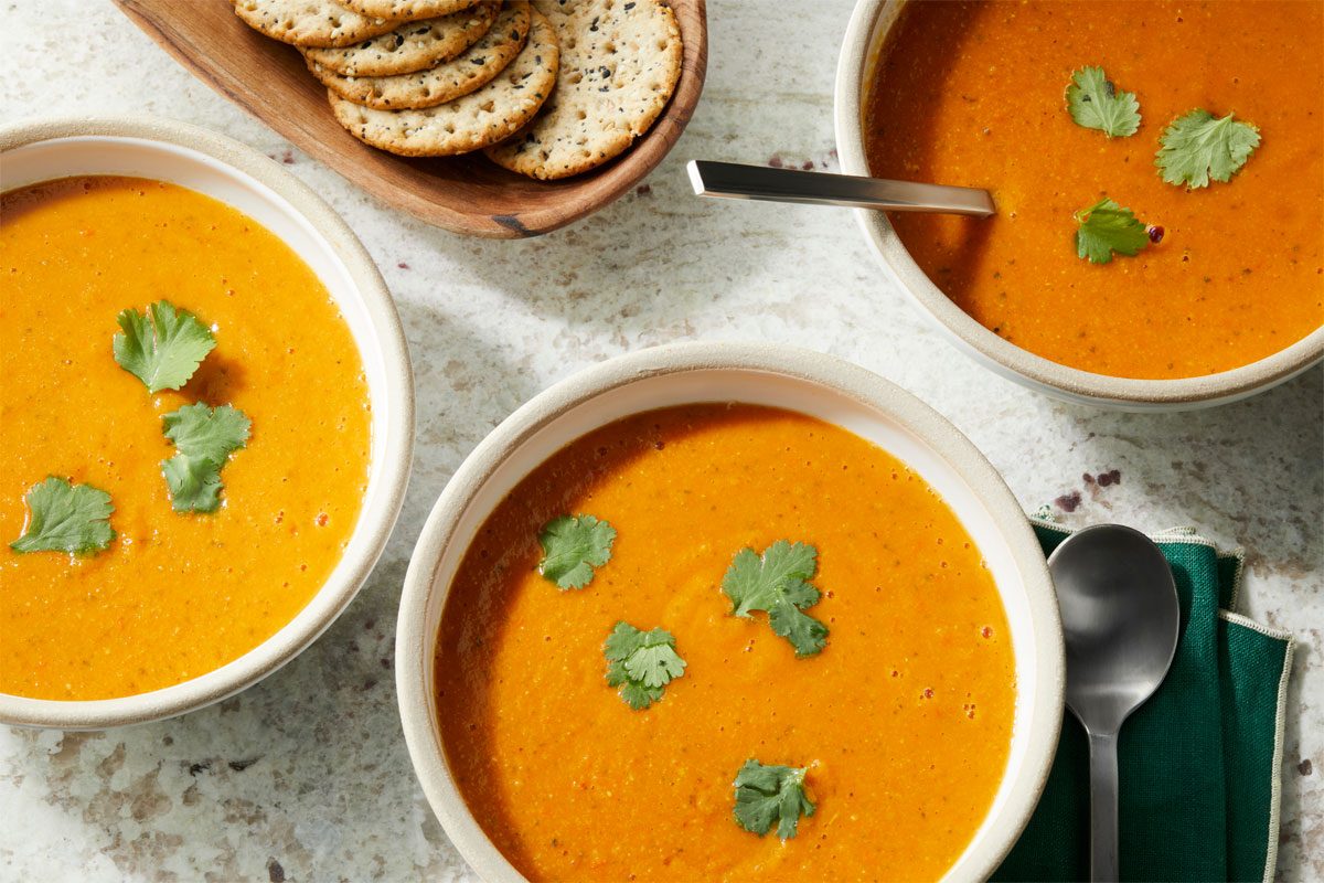 Red Lentil Soup served into a few bowls.