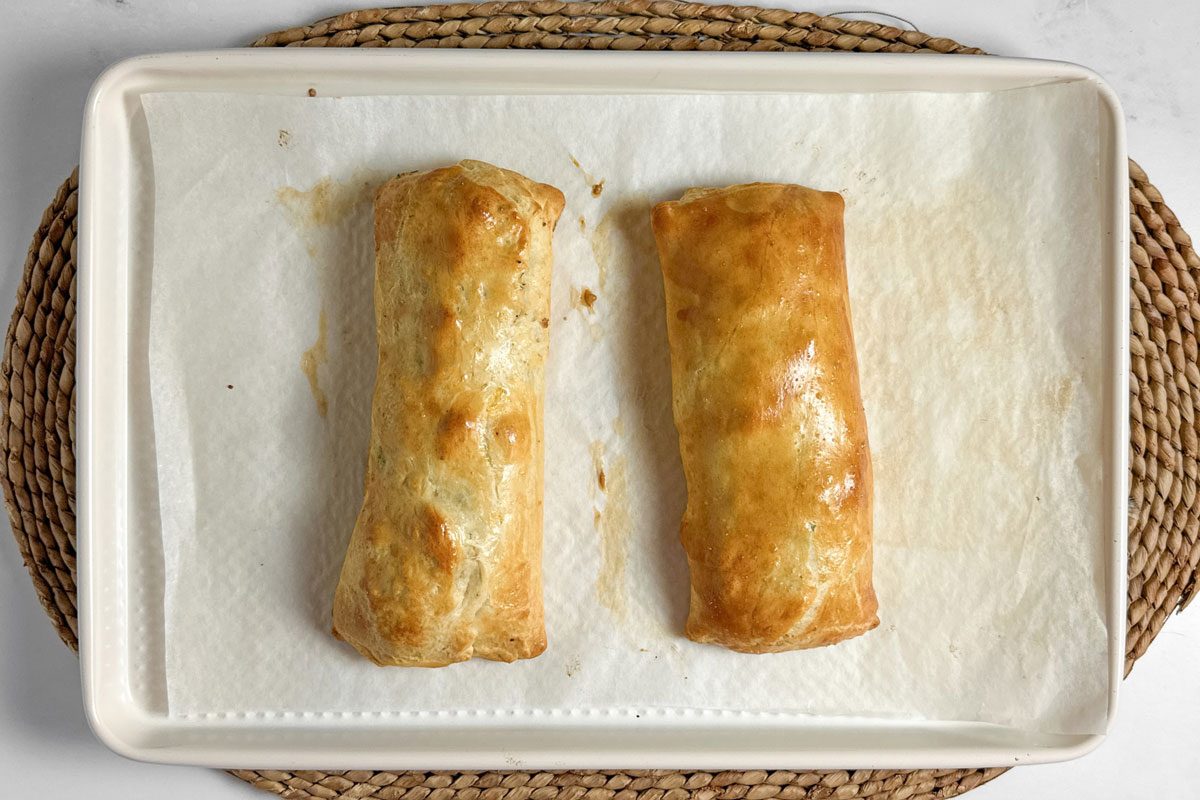 Taste of Home Sausage Crescent Rolls on a white baking sheet