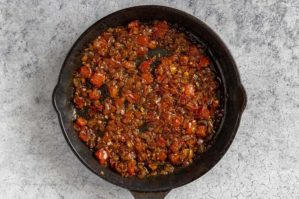 making the Shakshuka sauce in a skillet