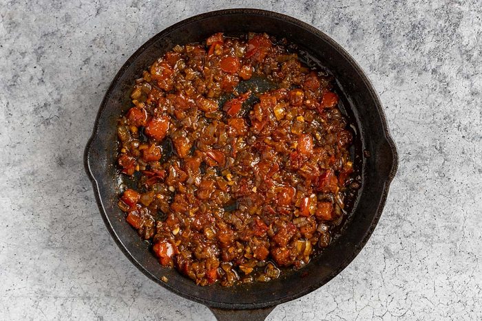 making the Shakshuka sauce in a skillet