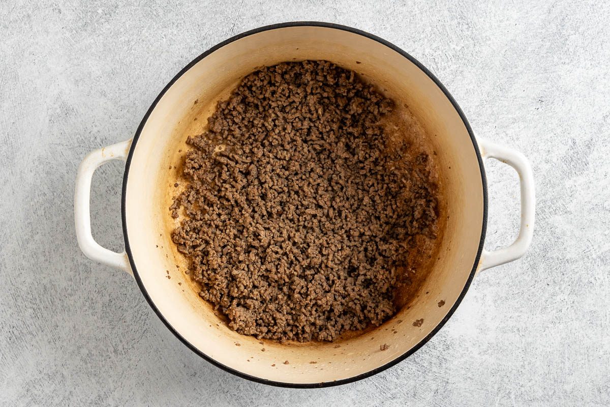 Taste of Home Sloppy Joe Pasta photo of the cooked ground beef in a Dutch oven.
