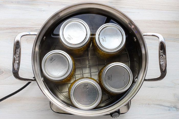 Canning pot with jars of squash relish.
