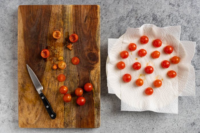 Taste of Home Stuffed Cherry Tomatoes photo of prepping the tomatoes.