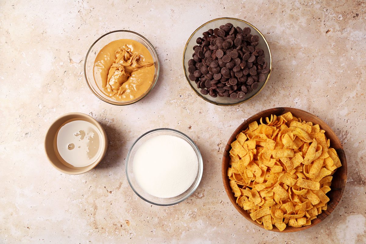 Ingredients for Taste of Home's Pumpkin Juice laid out in small bowls on a beige marble surface.