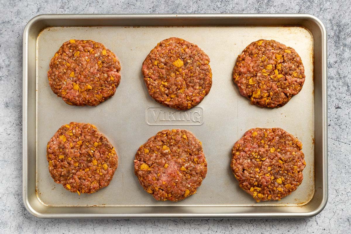 the prepared patties on a baking sheet