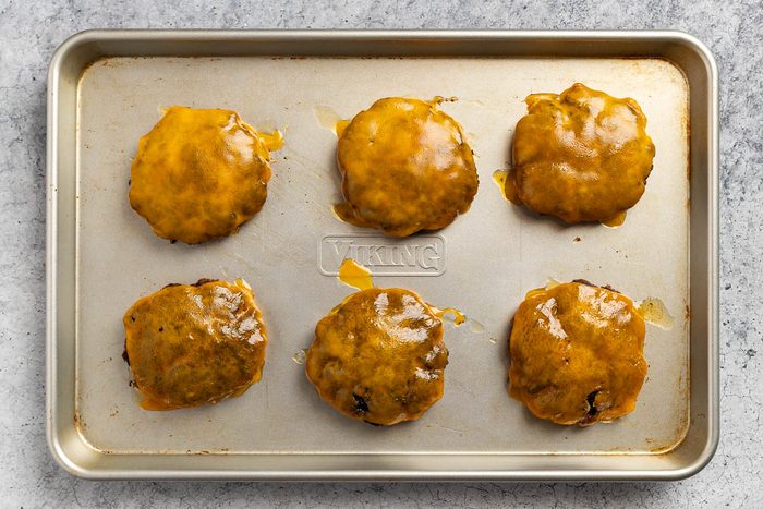 grilled burgers topped with cheese.