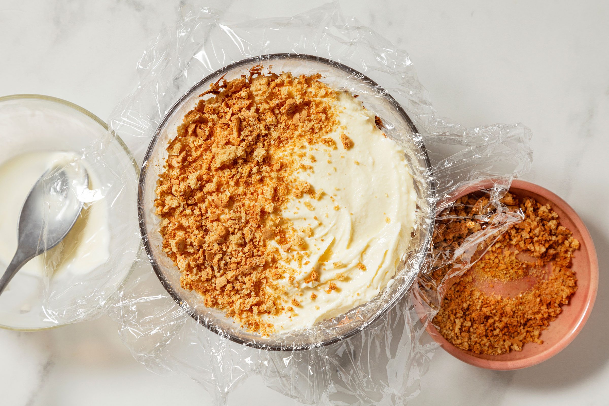 Vanilla ice cream and crumbled cookies on chocolate ice cream and fudge