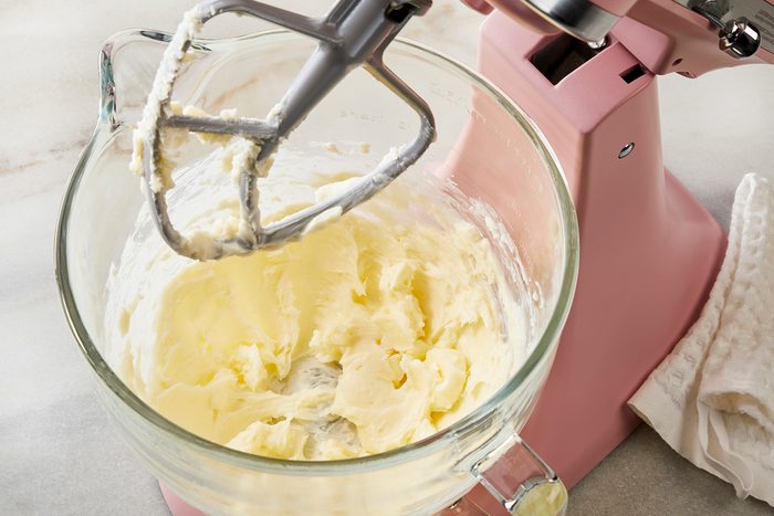 3/4th shot of a large bowl; beating butter and confectioners sugar with electric beater on medium speed until light and fluffy;