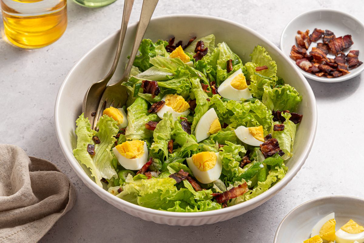 Bowl With Lettuce Salad, Boiled Eggs And Crispy Bacon