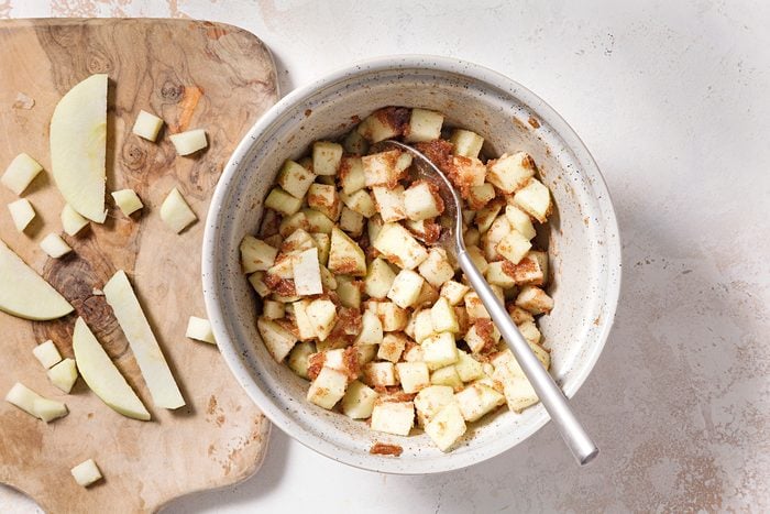 In a small bowl, combine melted butter, brown sugar and cinnamon. Fold in chopped apples