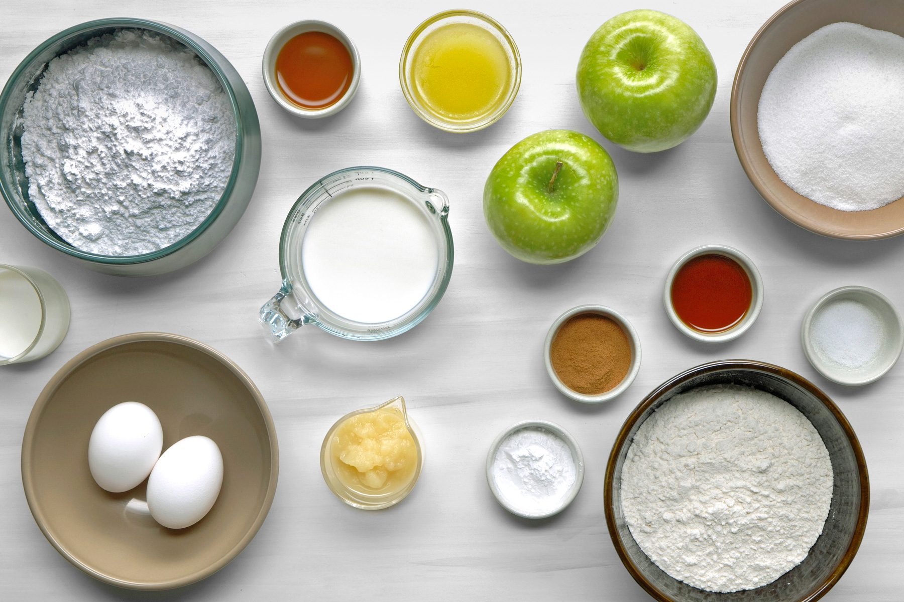 overhead shot of Apple Fritters ingredients placed over white background