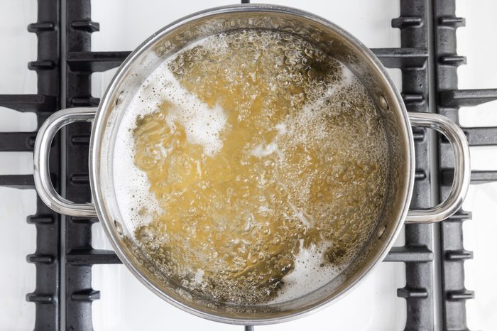 Penne cooking in boiling water.
