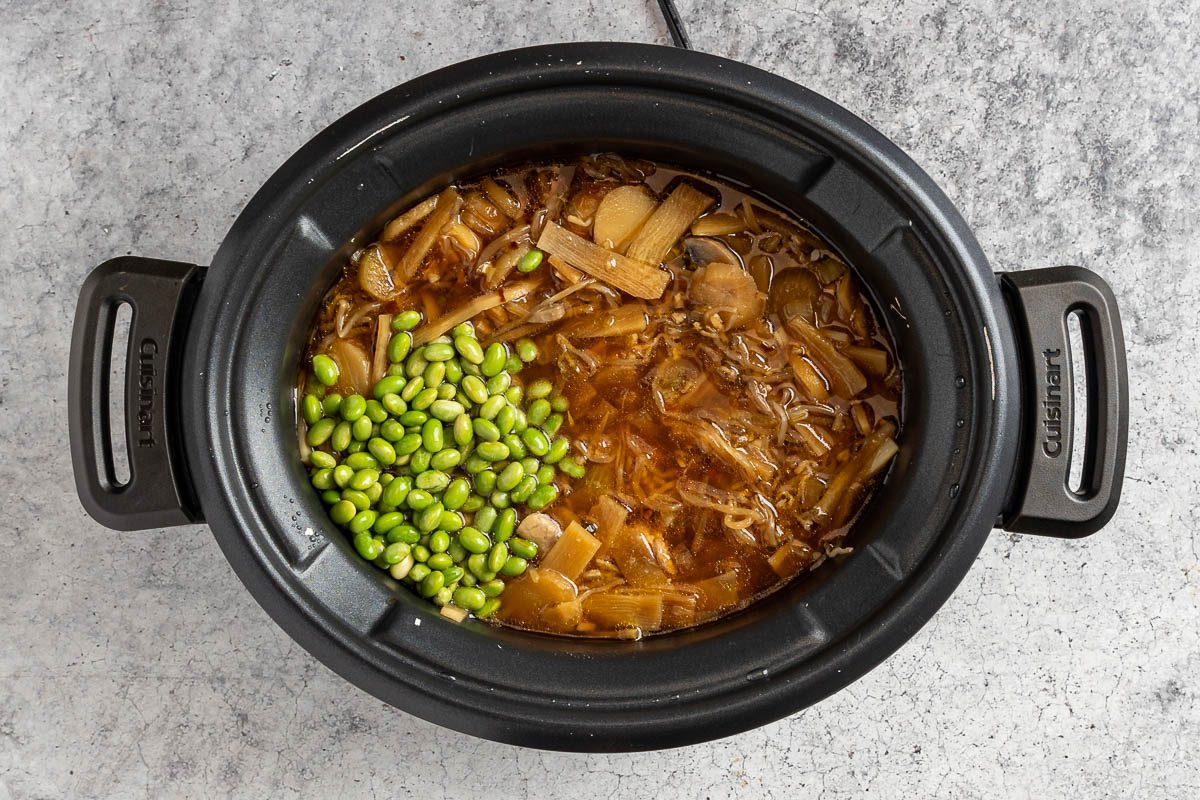 Taste of Home Chicken Chop Suey photo of the cornstarch and edamame added to the slow cooker.