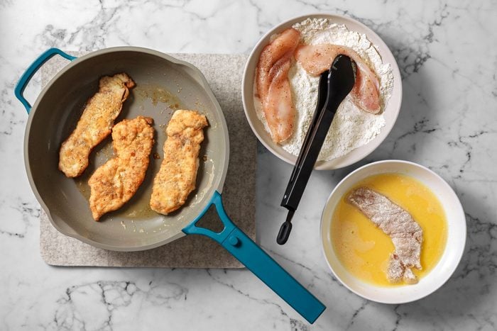 Dip chicken in flour to coat both sides, shake off excess. Dip in egg and place immediately into hot pan, cook until browned