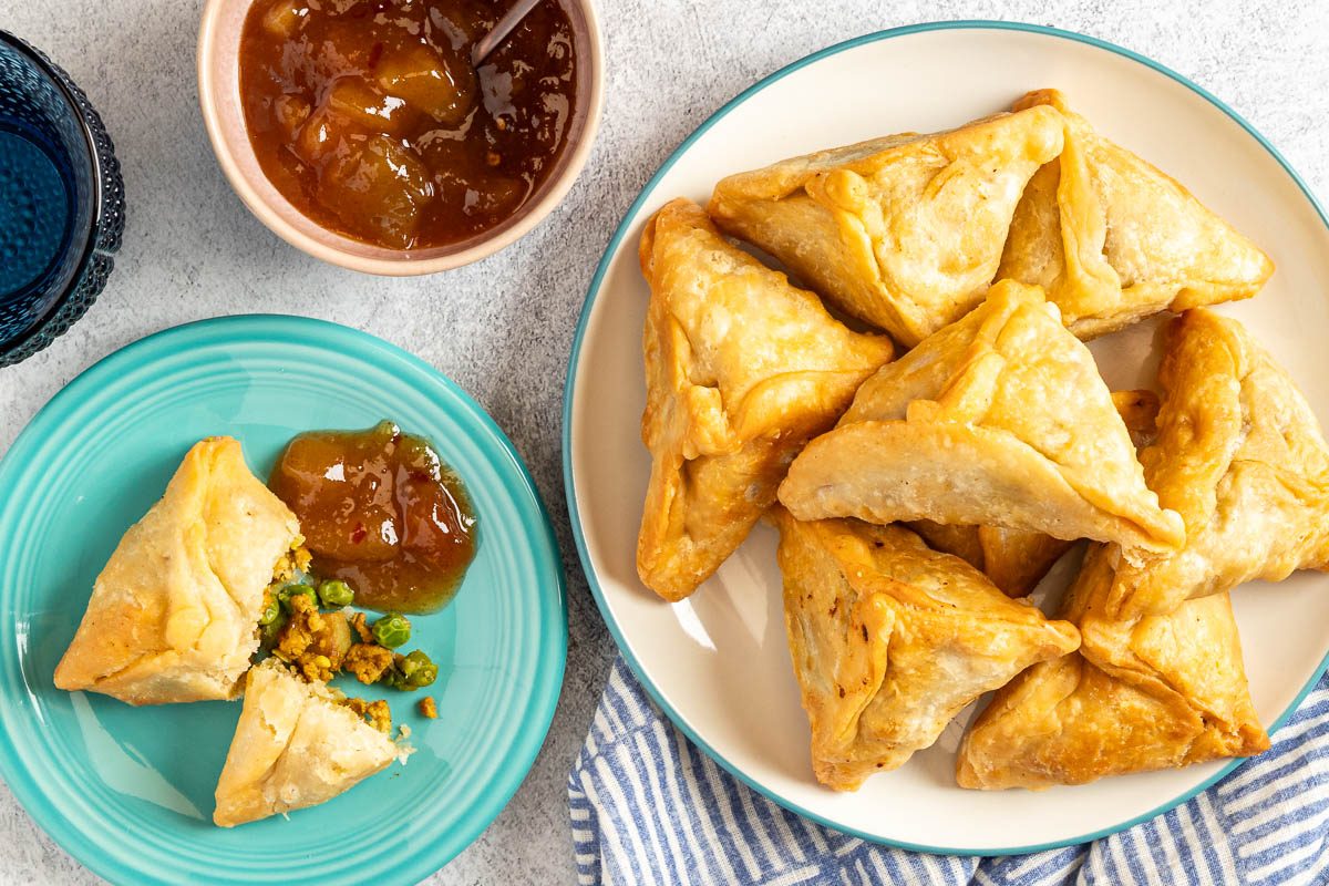 Taste of Home Chicken Samosa photo of the finished recipe served on plates.