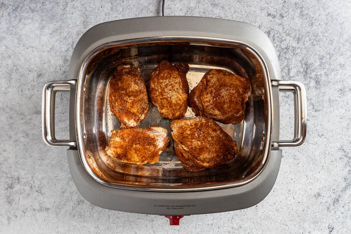 Taste of Home Cilantro Lime Chicken photo of the rub on the chicken in a slow cooker.