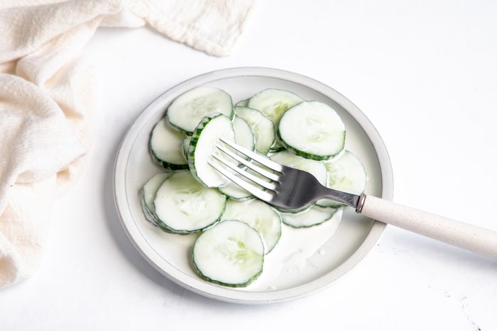 Beauty shot for Taste of Home Creamy Cucumber Salad on a plate being served.