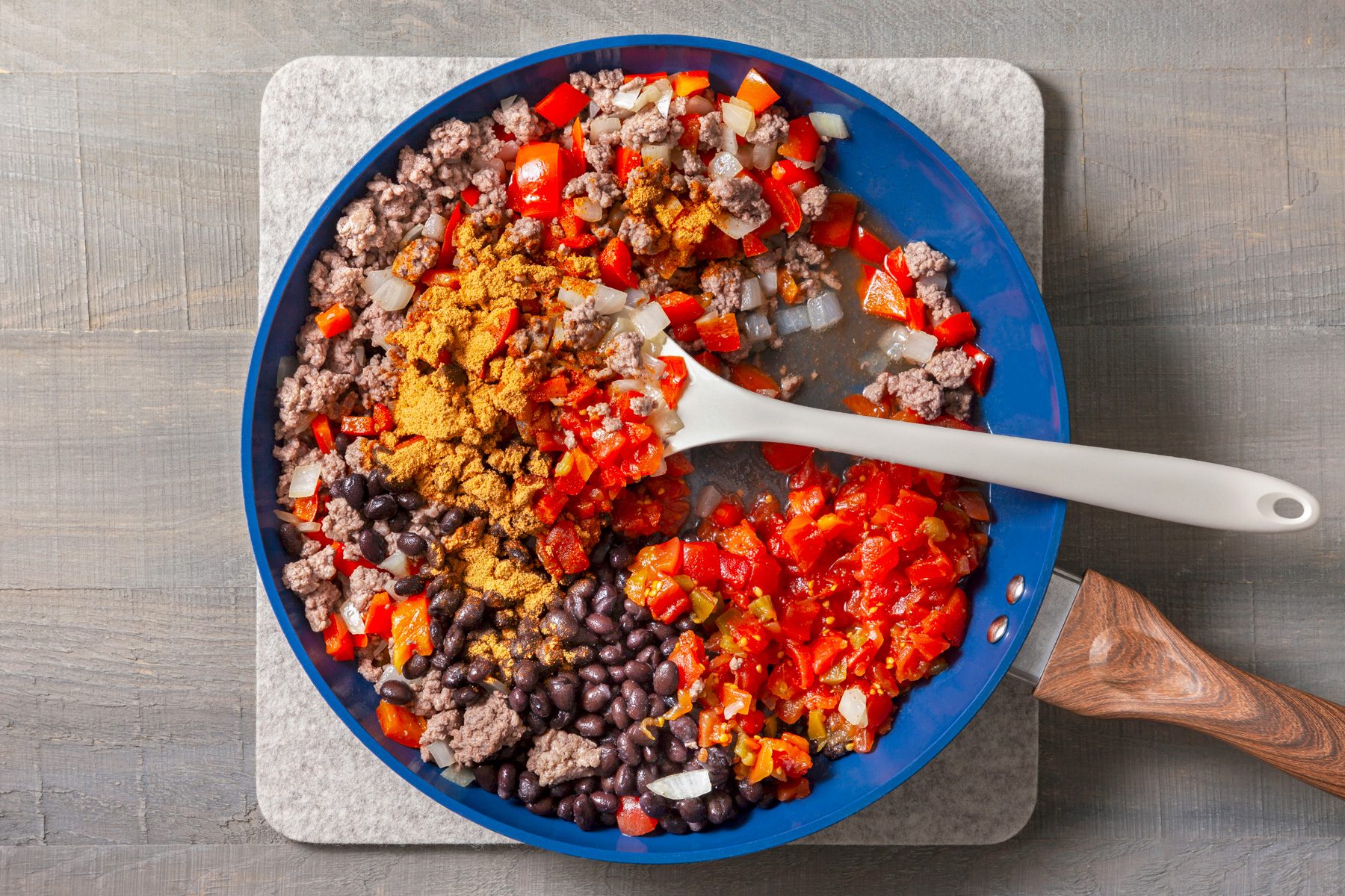 Stir in taco seasoning, black beans, and diced tomatoes.