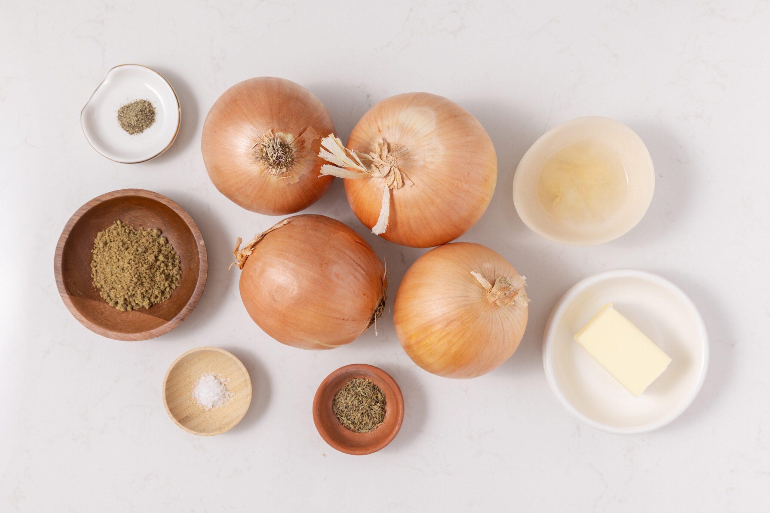 Ingredients for grilled onions on kitchen counter.