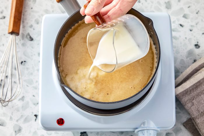 Whisk in stock and milk.