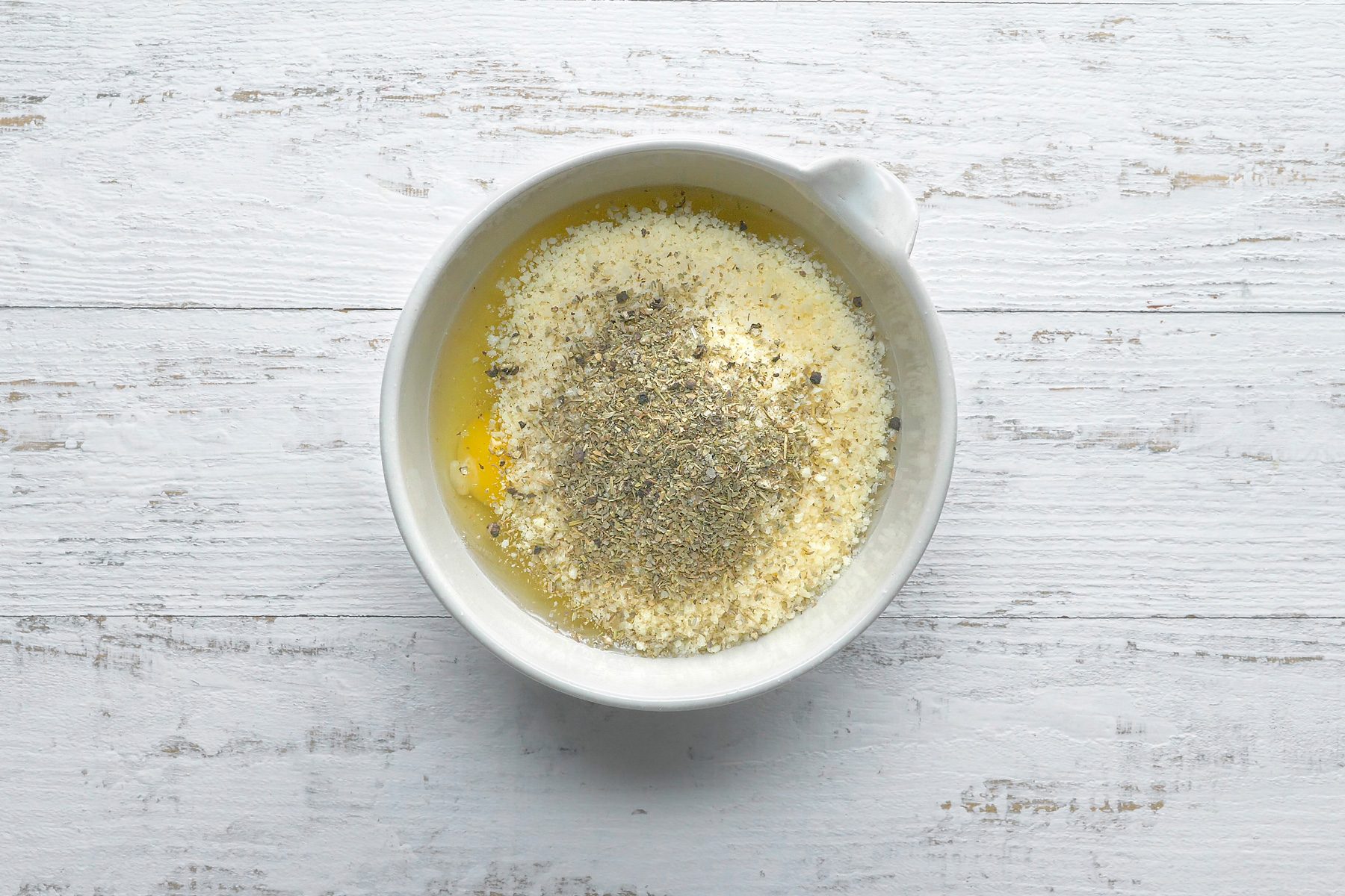 In a large bowl, whisk 6 eggs, Parmesan cheese, Italian seasoning and pepper.