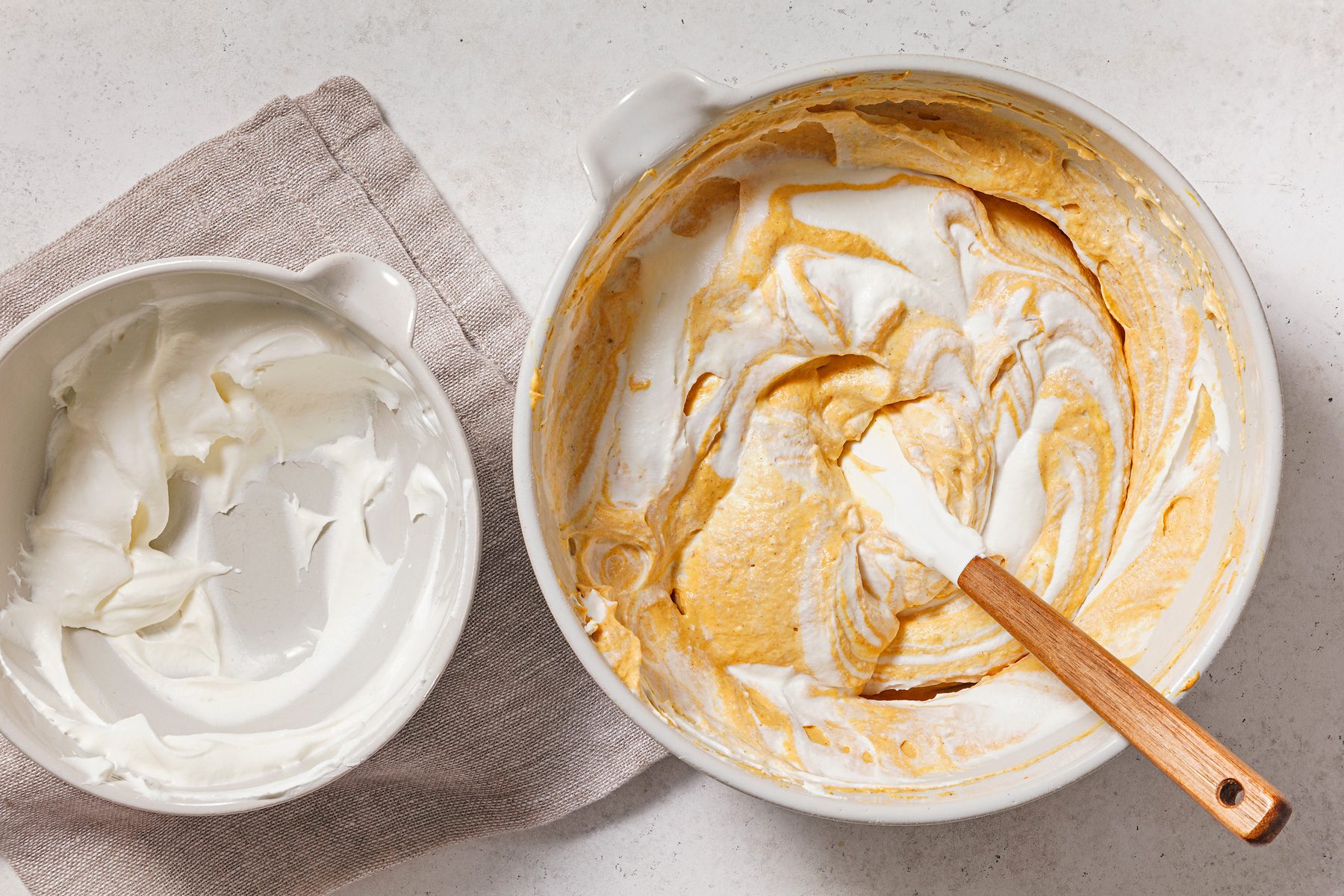 In a separate large bowl, beat heavy cream on medium-high speed until stiff peaks form.