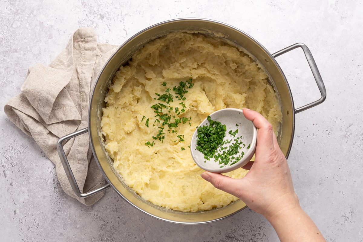 Chopped Parsley Mixed To Mashed Potatoes Inside Pot